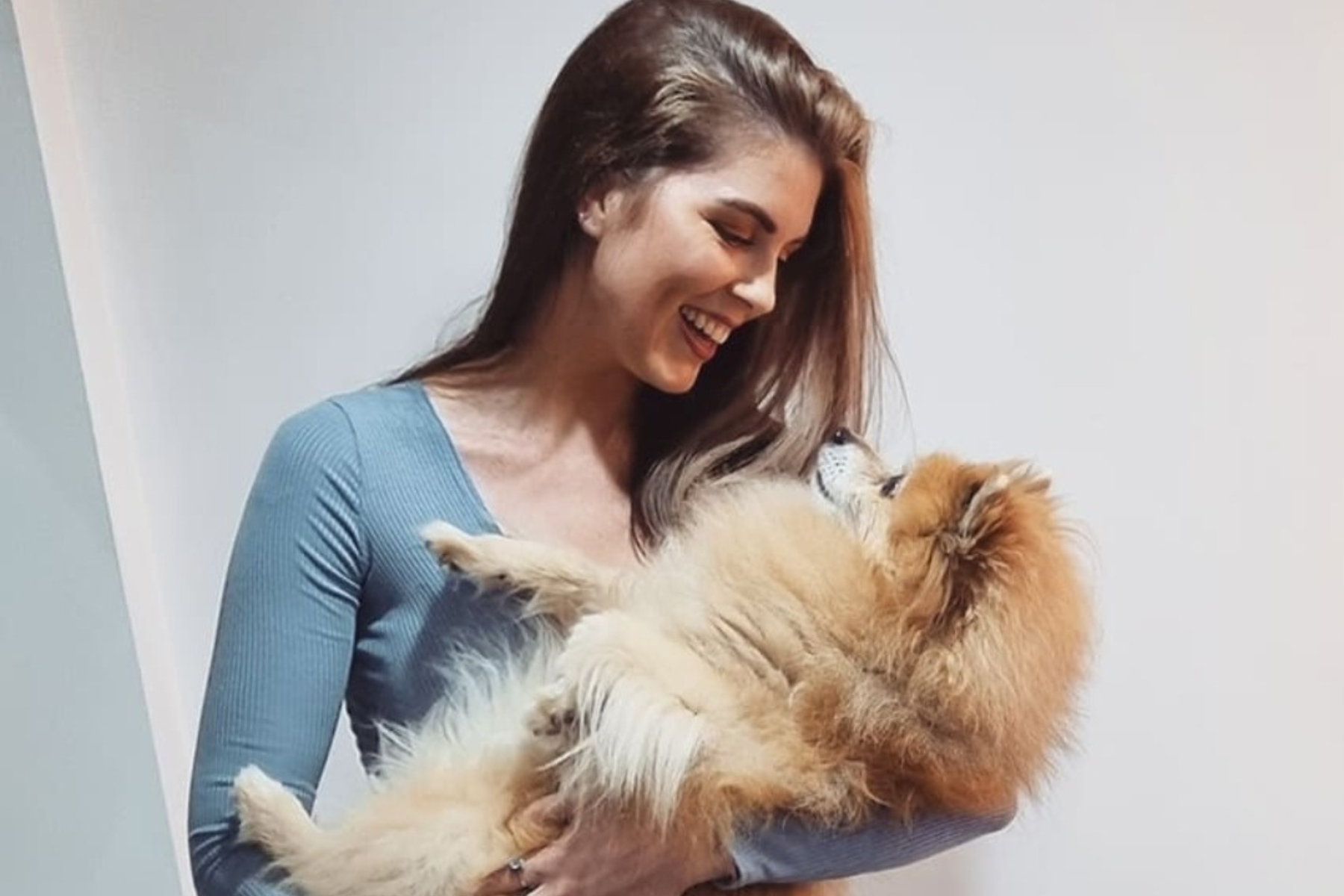 Founder of Stray To Stay Guatemala with a dog